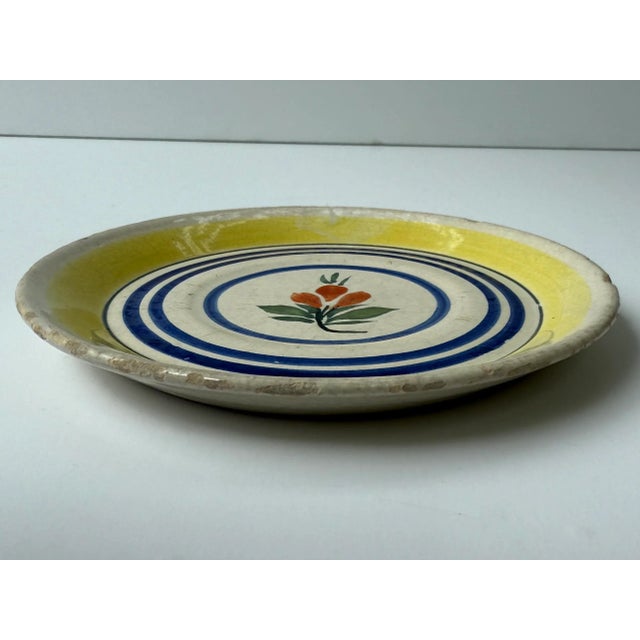 Antique plate with hand painted flower. Marked "Henriot Quimper France 729"