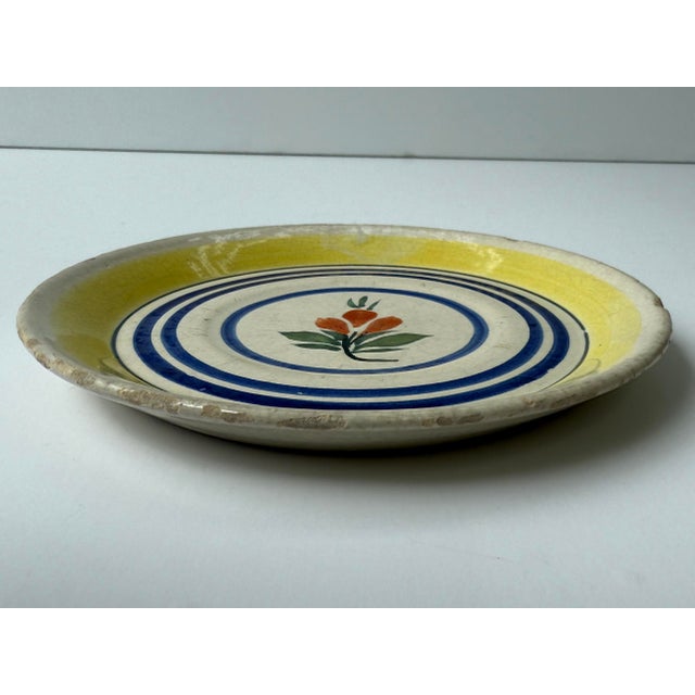 Antique plate with hand painted flower. Marked "Henriot Quimper France 729"