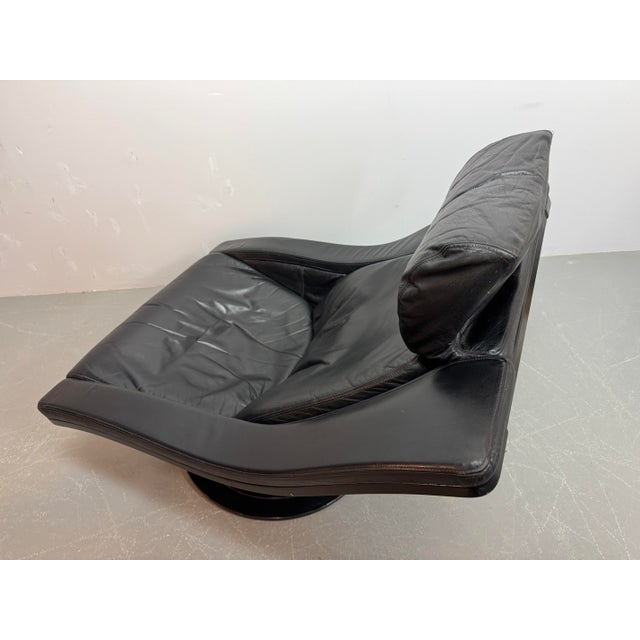 ‘Move’ swivel lounge chair with matching ottoman, designed by Takashi Okamura and Erik Marquardsen for Nelo. Upholstered...