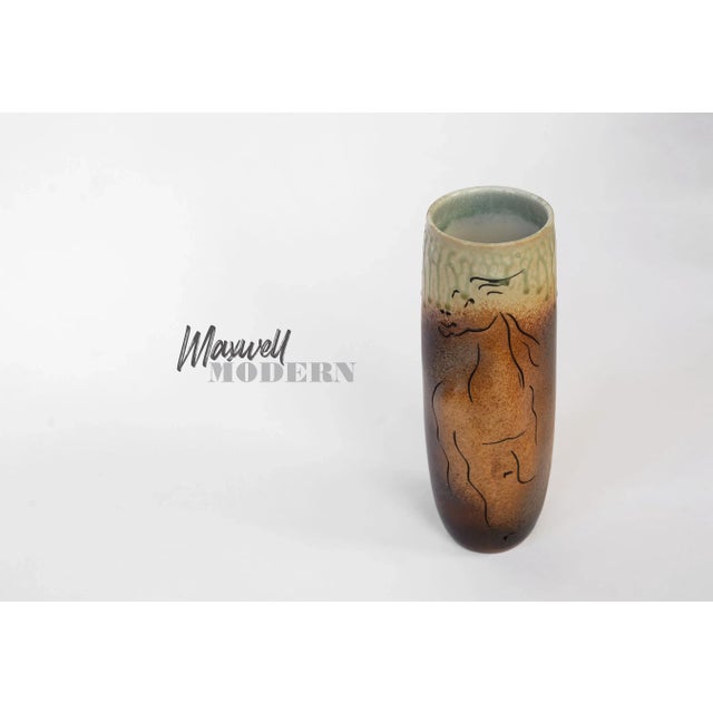 Stunning vase by American pottery Dan Ishler featuring an incised and relief horse design. The three dimensional quality...