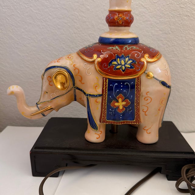 Bring a touch of Hollywood Regency elegance to your home with this stunning vintage mid-century ceramic elephant table...