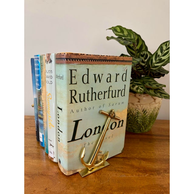 Pair of 1950s solid brass anchor bookends topped with metal rings. Brass is still bright and well preserved. Bottom is...