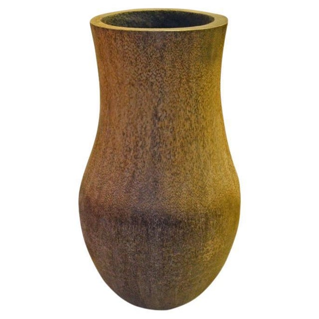 Coconut palm container with polished exterior. Interior is burned and hollowed out for usability. Great as sculptural...