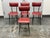Design Plus Gallery presents a Set of Four 1930s Italian Design Dining Chairs. Each chair has red vinyl upholstery across...