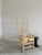 Artisan crafted, sculptural birch twig chair with woven checkerboard seat. We love this unique, one-of-a-kind chair....