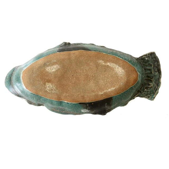 Mid Century Blue Green Ceramic Fish Serving Dish with abstract and shell imprinted designs. Signed on reverse.