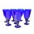 Exquisite, joyful and heavy set of eight midcentury crystal stemmed glasses handblown in cobalt-blue. Exhibiting a...