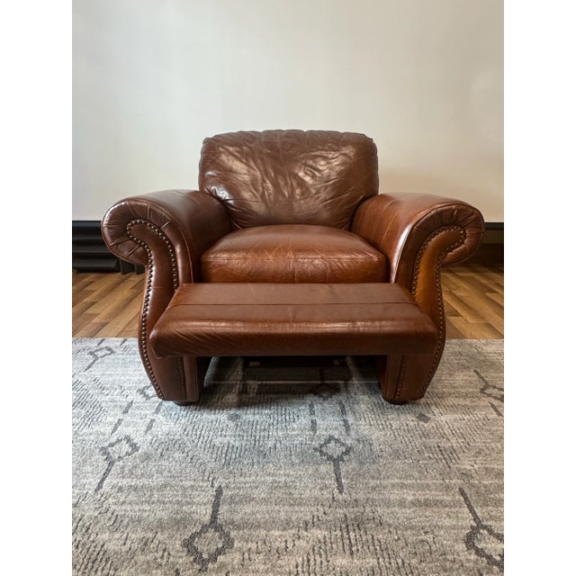This solid and sturdy recliner features a rich, warm chocolate brown leather upholstery, which has aged over time with a...
