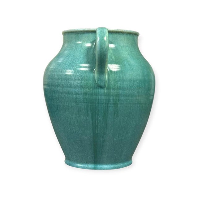 An elegant Sylvan Ware twin-handled vase produced by Poole Pottery in England during the early 1930s. The vase features a...