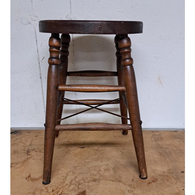 Antique Heywood Wakefield Wooden Stool. It is 18.5'' high and the legs are 13" apart. The seat is 12.25" wide. It has...
