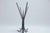 Stunning workmanship on this elegant, ornate, hand forged, and hammer faceted wrought iron coat rack from the early...