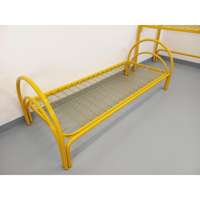 Two vintage bunk beds from the 1980s, by the Italian brand Maretto Marflex, in the style of Gae Aulenti, in yellow metal....