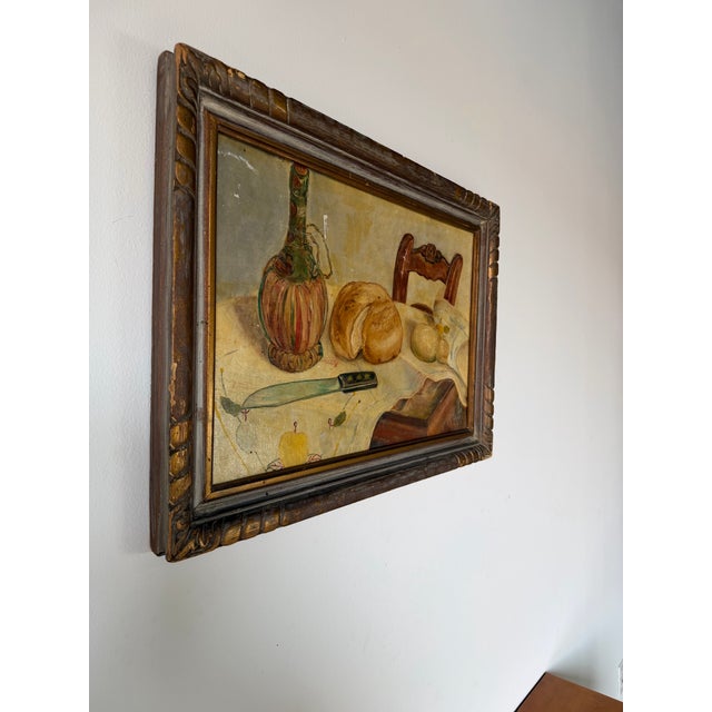 Charming 1949 vintage still life oil on board painting depicting a rustic kitchen table arrangement with bread,...