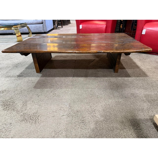 This live wood low coffee table embodies understated craftsmanship and natural beauty, showcasing the rich character of...