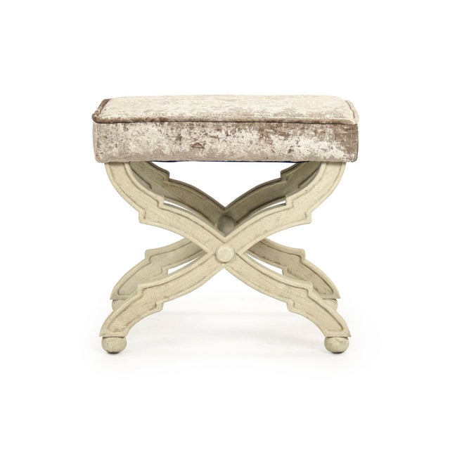 The Crescenzo Single Bench from Zentique is a compact, sculptural X-base stool with ornate carved and curved legs...
