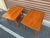Beautiful matching pair of teak side tables from France and Son of Denmark. These tables were designed by the famed design...