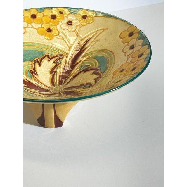 This Art Deco ceramic centerpiece bowl by Thomas Forester & Sons, produced in Staffordshire, England in 1932, is a...