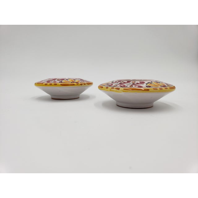 These gorgeous candleholders featured a hand-painted floral design in yellow and pink. They were made in Caltagirone,...