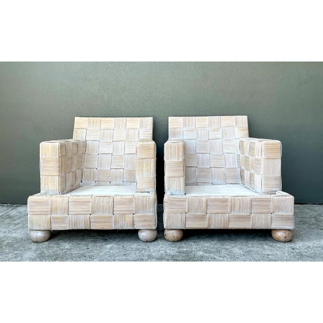 This vintage woven rattan sofa, crafted in the style of John Hutton for Donghia, embodies the refined material innovation...