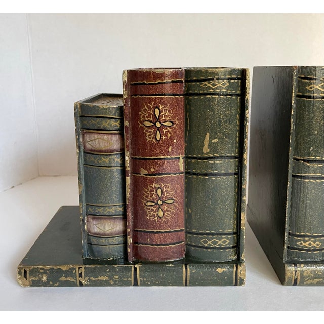 Here is a wonderful pair of bookends that are made to look like stacks of books! They feature carved wood and painted...