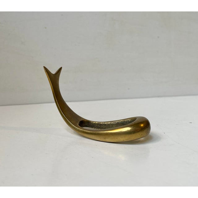 A vintage Pipe Stand/holder in the shape of a whale/fish. Its executed in solid brass. Originally sold at Illums Bolighus...