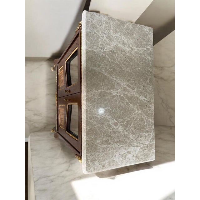 Elevate your interior with this exquisite Antique French Louis XV Style Cabinet, a truly timeless piece blending...