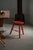 A charming pair of vintage wooden stools, featuring three splayed legs connected by crossbars for added stability. The...