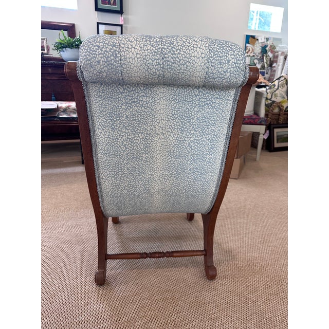 This brown Swedish seat contains it's original seating material, completely reupholstered in Schumacher's Mini Leopard...