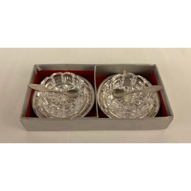 A fine pair of crystal and silver plated salt and pepper or small caviar serving dishes with their spoons and coasters....