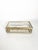 Decorative glass and metal jewelry box dating from the 2000s, France. The rectangular box features transparent glass...