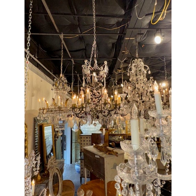 Late 19th century French iron and crystal chandelier with amethyst grapes. Circa 1880. The chandelier has been...