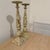 This is a pair of Vintage Neoclassical Cast Iron Pillar Candlestick Holders featuring a heavily distressed, chipped...