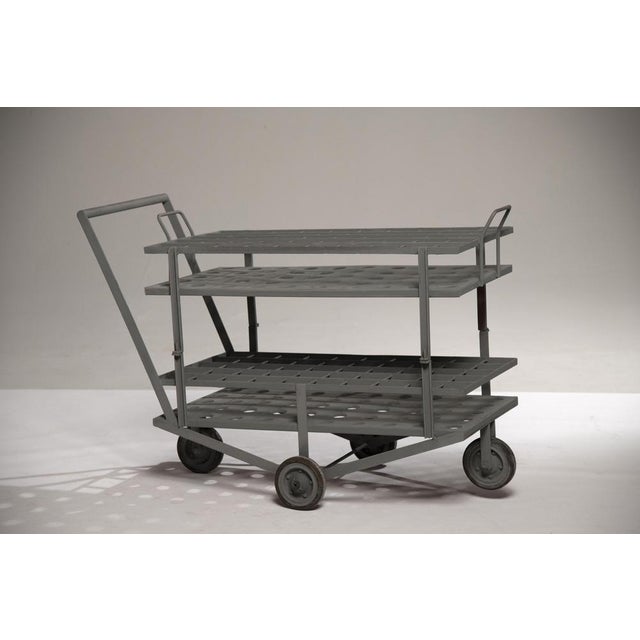 1970s industrial iron bottle trolley, France. Featuring a distressed finish, it was originally used for champagne...