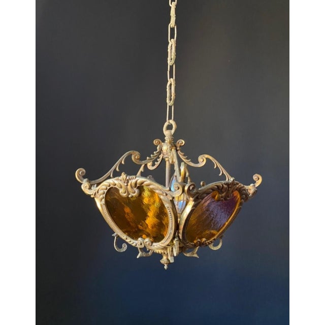 The chandelier is made of brass and bronze—an extraordinary piece of handcrafted work. It is adorned with beautiful,...