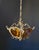 The chandelier is made of brass and bronze—an extraordinary piece of handcrafted work. It is adorned with beautiful,...