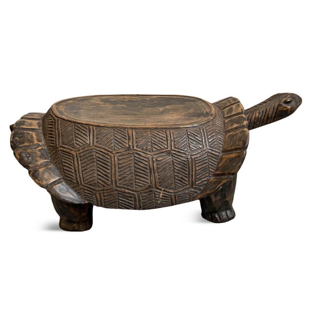 Vintage carved wood turtle stool from Burkina Faso. Perfect for use as a small bench/stool or as an accent table. Unique...