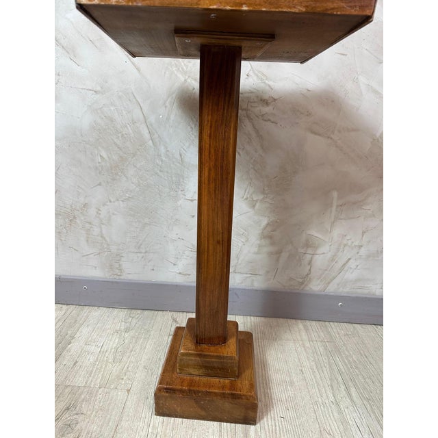 A superb Art Deco side table, crafted from walnut and dating from the 1930s. This piece is distinguished by its...