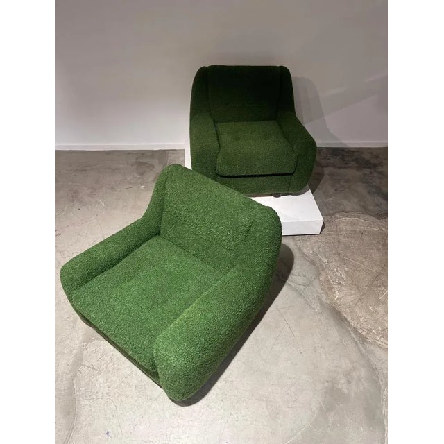 Pair of green bouclette armchairs made in Italy. Organic shape typical of “Space age”. 1970s. New fabric.