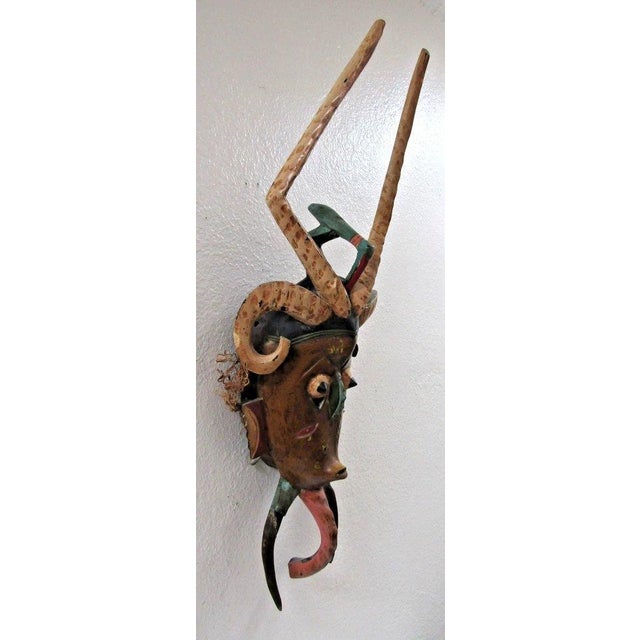 Antique Hand-Carved Polychrome Wooden Gouro Zauli Mask of the Ivory Coast Measures 10 1/4" wide, 7" deep and 30" tall....