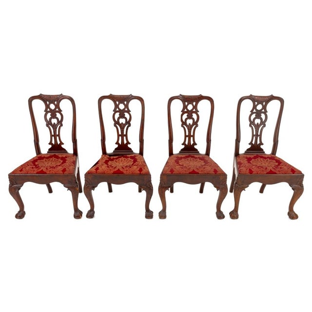 Set of Four Portuguese Carved Mahogany Dining Chairs, 18th century, each with pierced backsplat, red silk brocade covered...