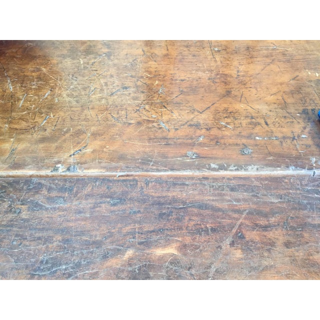 The rectangular top is raised on trestle legs joined by a baluster shaped stretcher. Vintage condition, see images.