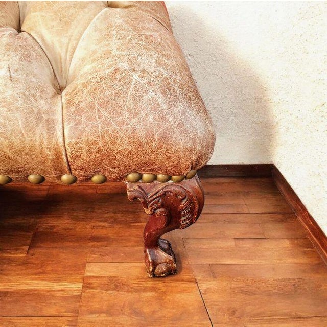 Discover the perfect blend of rustic charm and sophisticated design with this exquisite Chesterfield leather ottoman,...