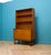 A mid century teak tall record cabinet or bookcase from Turnidge, circa 1960s Featuring two shelves and additional file or...