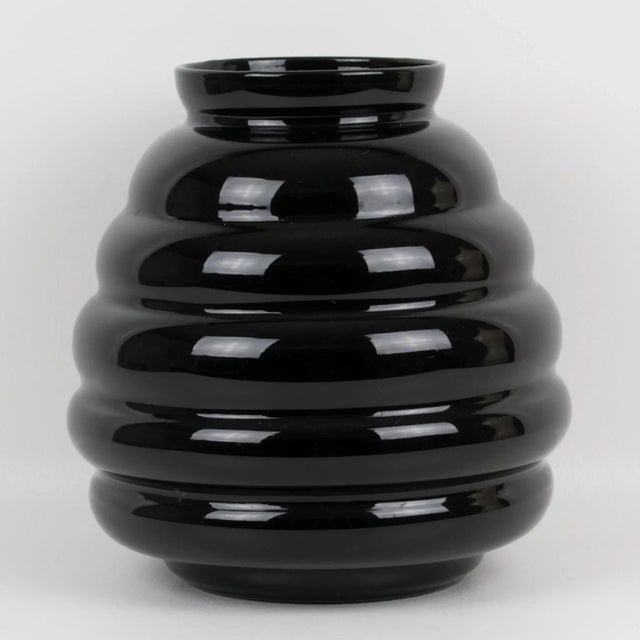 A stunning black glass vase made in Belgium circa 1950. Huge rounded design with a gadroon shape. Marked underside: " Ver...