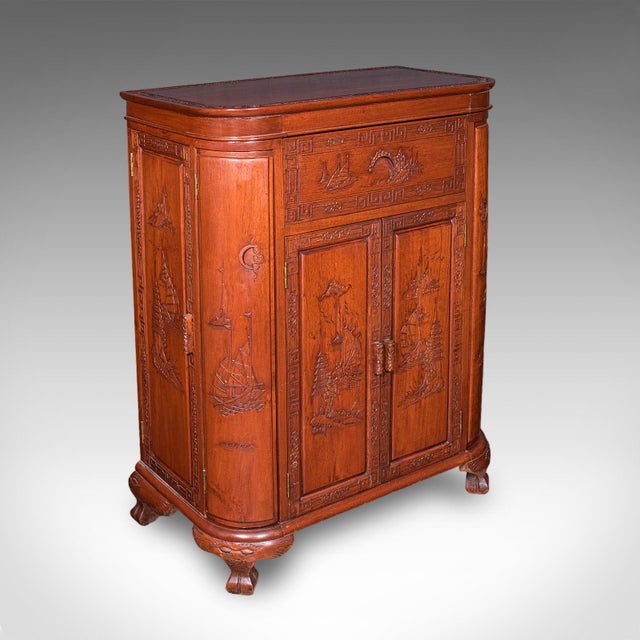 This is a vintage cocktail cabinet. A Hong Kongese, mahogany dry bar with counterweighted drinks tray, dating to the mid...