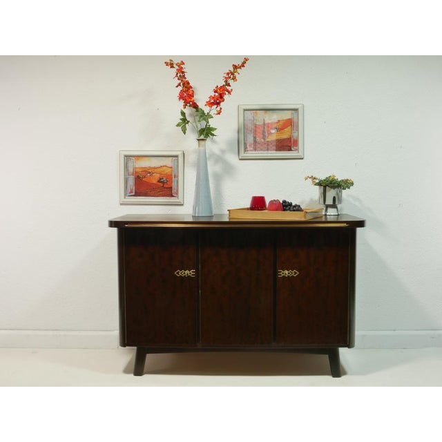 The sideboard is an original from the 50s and is very high quality. It was produced in 1954 in an art furniture factory in...