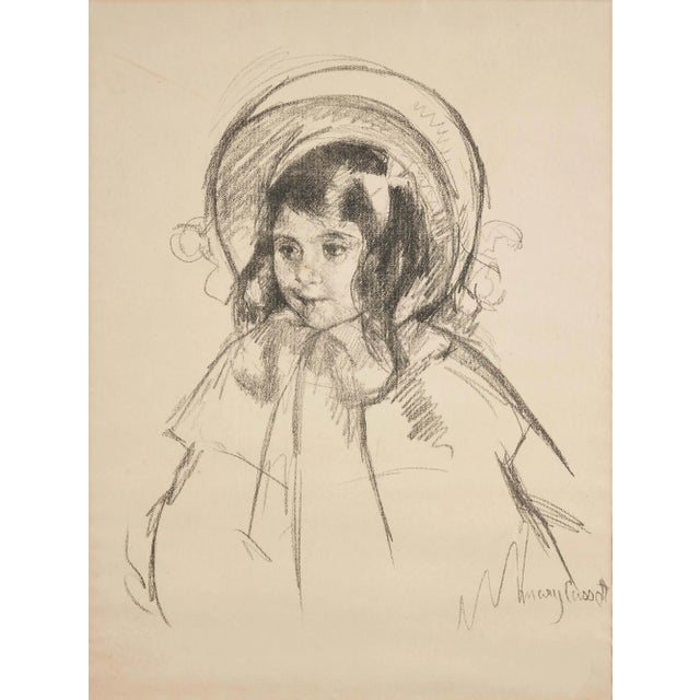 A transfer lithograph by American Impressionist Mary Cassatt (1844-1926), Sara Wearing her Bonnet and Coat, c. 1904 is...