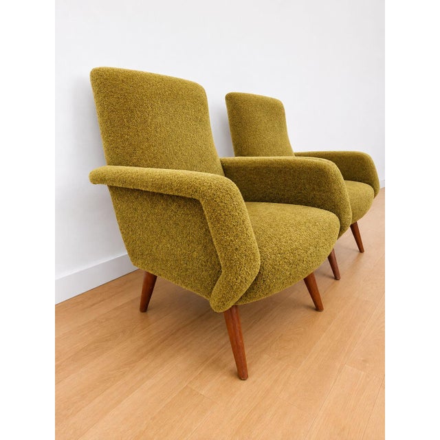 A splendid pair of Italian-designed armchairs from the 1950s, fully attributable to the organic and dynamic style of Marco...