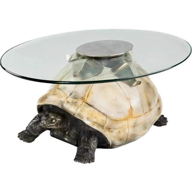 A coffee table by Anthony Redmile, London, circa 1970. Base of the table is fashioned from composite painted turtle under...