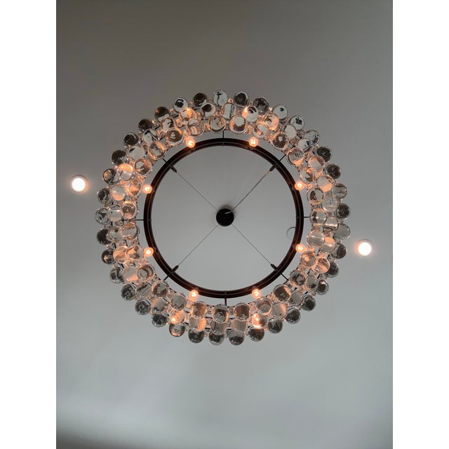 Modern Glass Orb Chandelier Stunning oversized chandelier featuring a black metal frame with dozens of hand-blown clear...